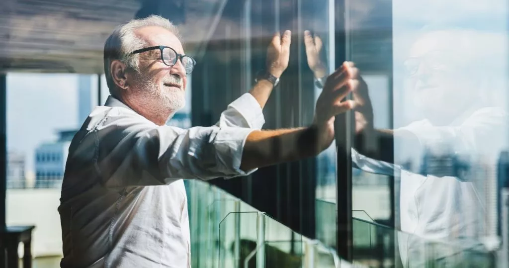 man touching window